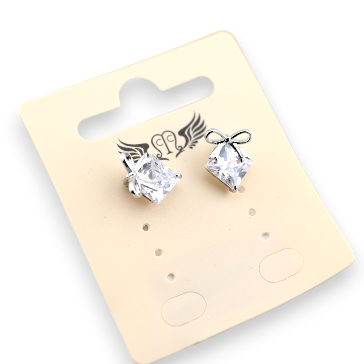 Boucle d'oreille fantaisie argentée pierre brillante noeud argenté