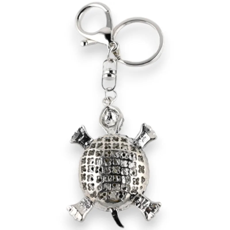 Porte-clés argenté en forme de tortue ornée de strass noir et blanc, avec anneau