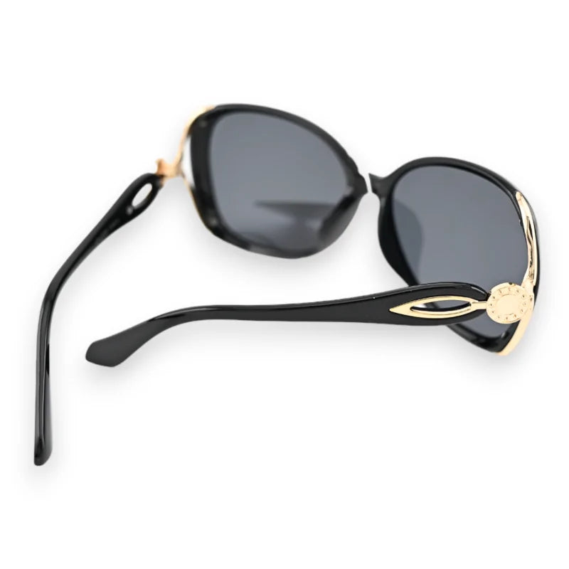 Lunettes de soleil noires grand modèle avec monture dorée, style élégant et classique