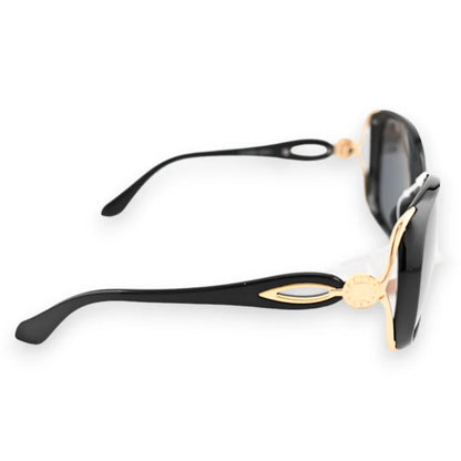 Lunettes de soleil noires grand modèle avec monture dorée et branches décoratives é...
