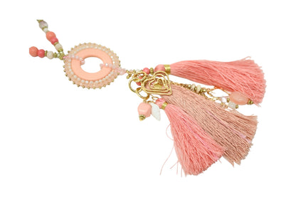 Collier sautoir fantaisie nuances rose médaillon rond pompons et breloques