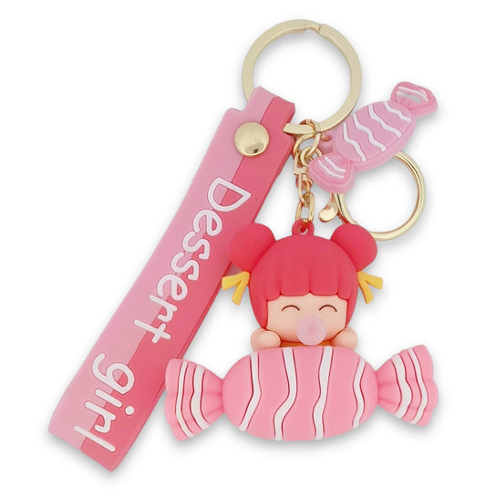 Porte-clés petite fille sur un gros bonbon