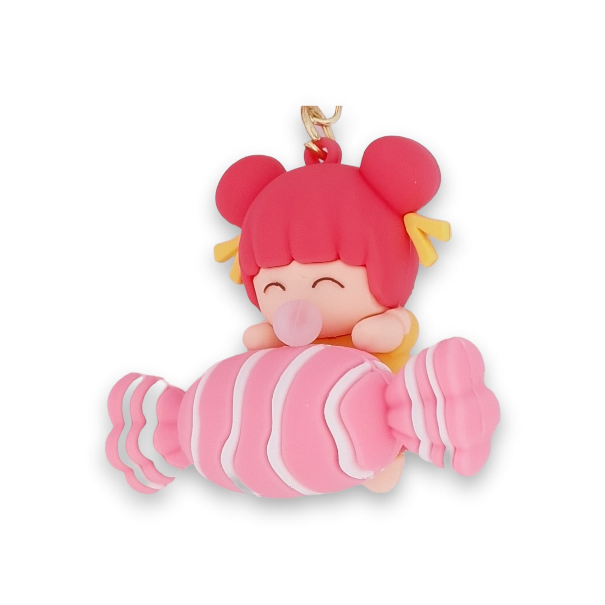 Porte-clés petite fille sur un gros bonbon